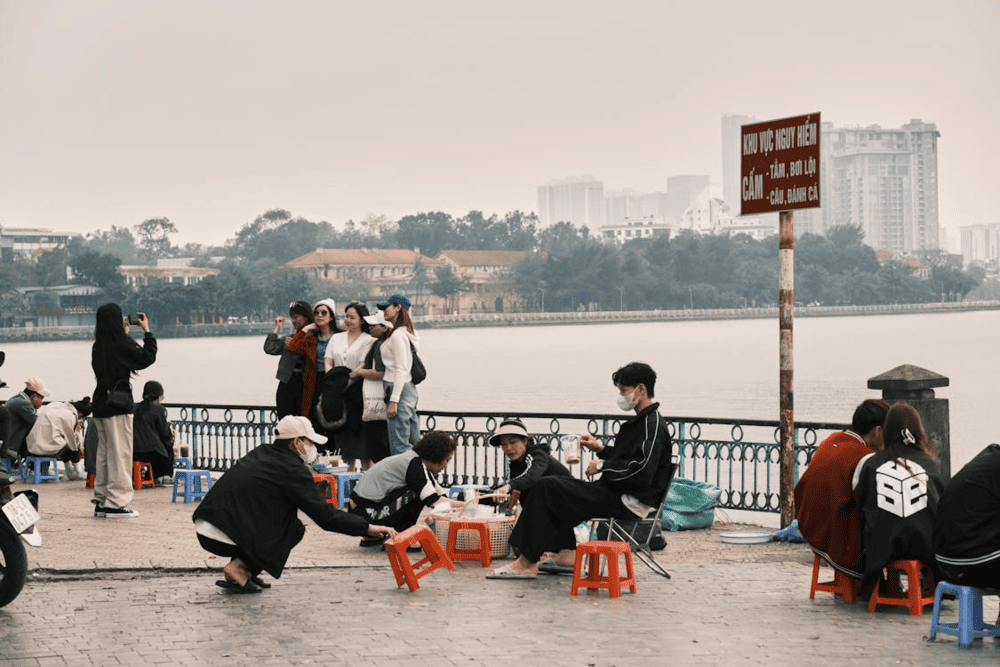 Enjoy your favorite beverage with the calming embrace of West Lake's morning serenity (Source: Pexels)